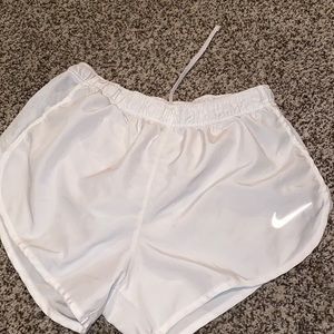white nike athletic running shorts